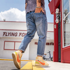 Jean extensible déchiré à la cheville pour hommes de grande taille 