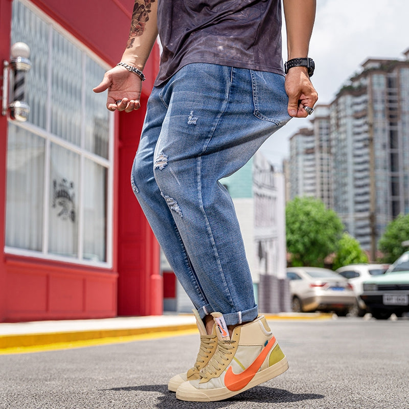 Jean extensible déchiré à la cheville pour hommes de grande taille 