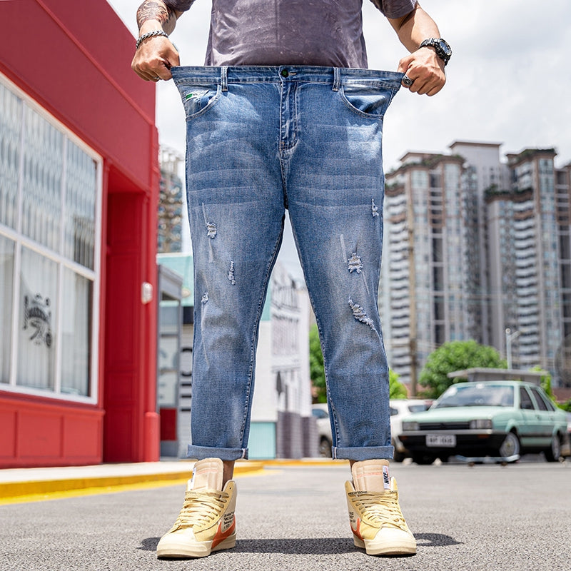 Jean extensible déchiré à la cheville pour hommes de grande taille 